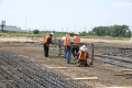 construction, sitework, preparation, work crew, tying pier steel