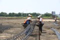 construction, sitework, preparation, work crew, tying pier steel